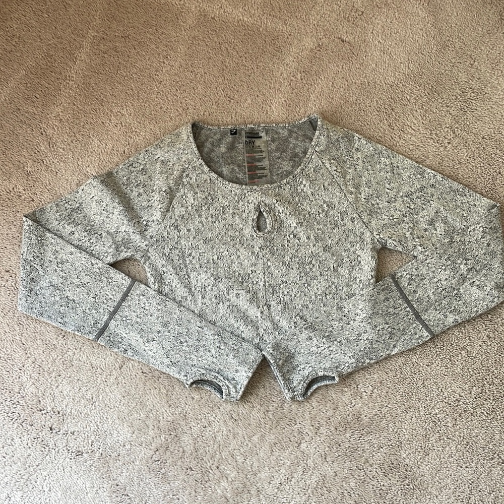 Never worn Gymshark long sleeved crop top with detail keyhole in small